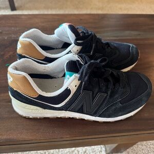 New Balance 574. Women’s size 9. Black and tan.